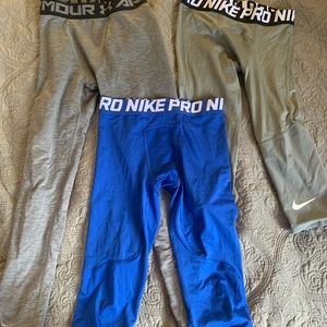3 pairs of leggings size youth medium. Nike Pro and Under Armour